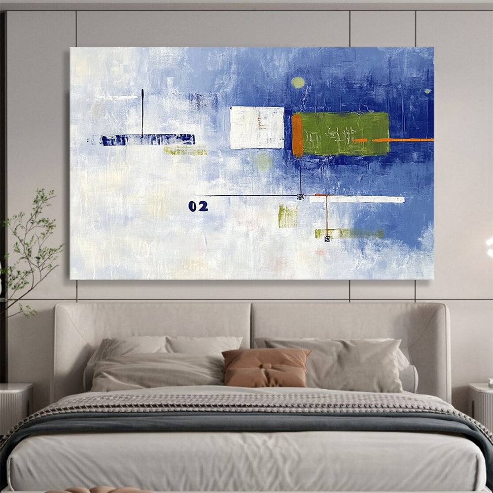 A large abstract painting with broad brush strokes in cool blue and white, featuring bold geometric shapes in green and orange, creating depth and contrast.SC493