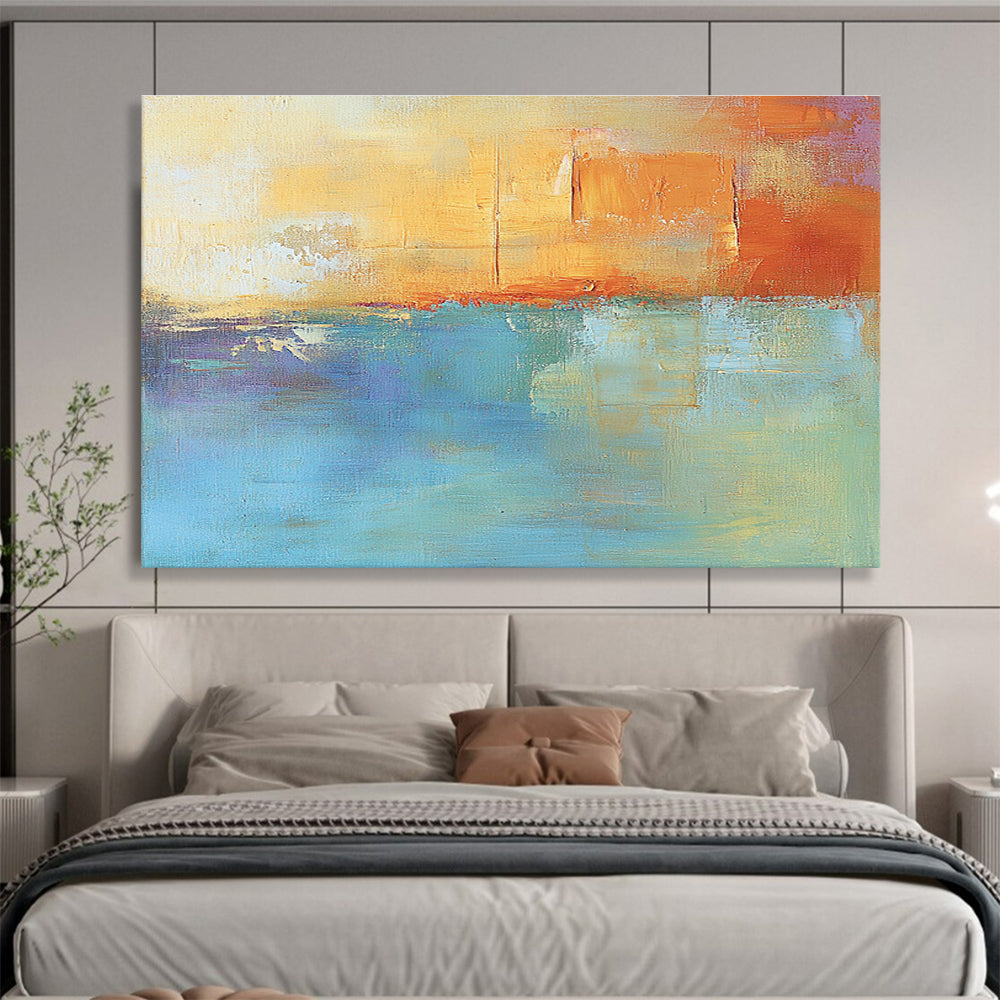 Large abstract oil painting in muted orange and aqua with soft shapes and blurred edges evoking calmness and tranquility through its impressionist style.SC124
