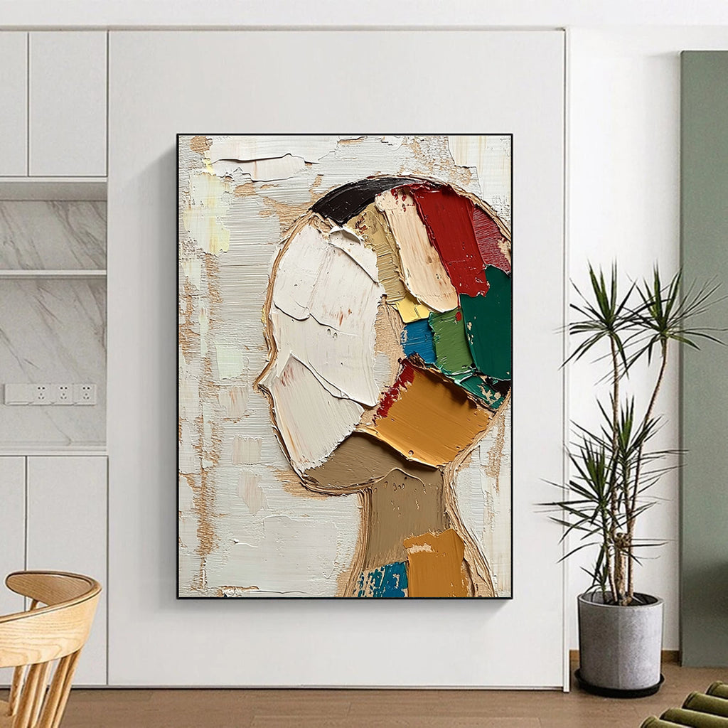 Large abstract painting featuring a round face with short hair in vibrant colors against a beige and white background with visible brush strokes.STSC197