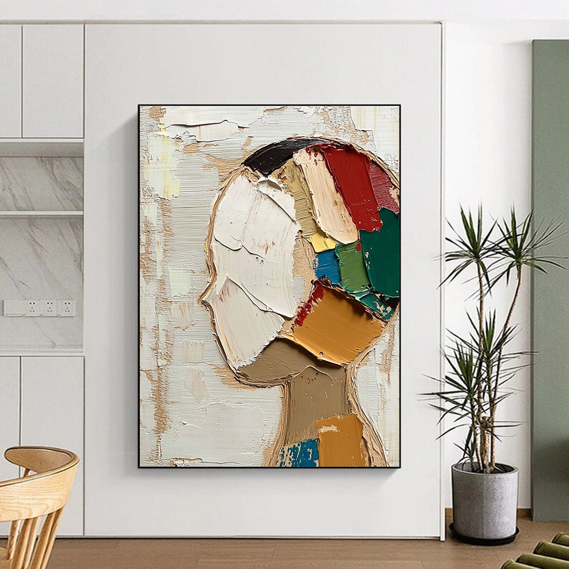 Large abstract painting featuring a round face with short hair in vibrant colors against a beige and white background with visible brush strokes.STSC197
