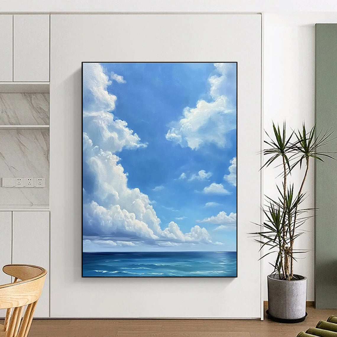 A large abstract painting featuring a blue sky with white clouds and a vast ocean below in a minimalist oil painting style.STSC923