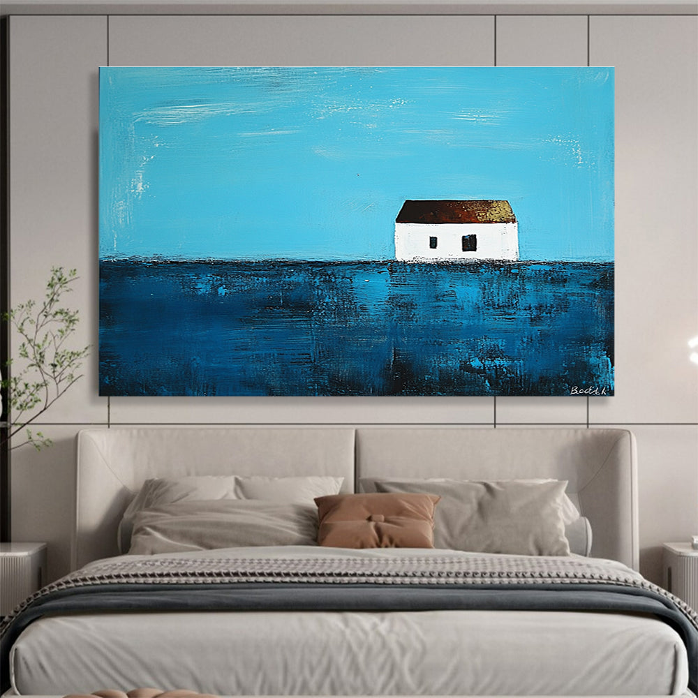 A large abstract painting featuring a small white house on the horizon surrounded by deep blue sea in the style of Anna Bocek.SC553