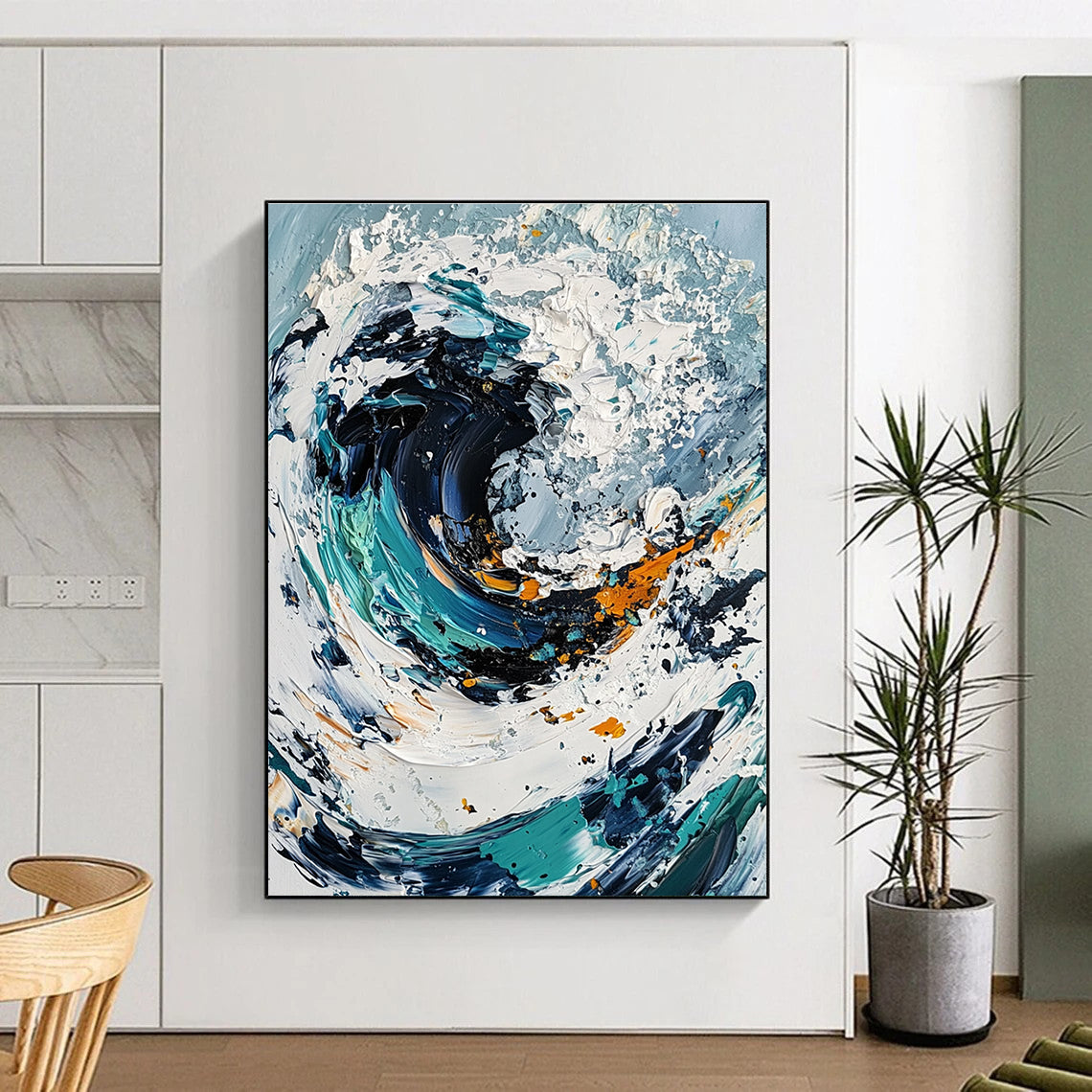 Large abstract painting of an ocean wave in white and blue tones with black center and colorful details created using a palette knife on canvas.STSC263