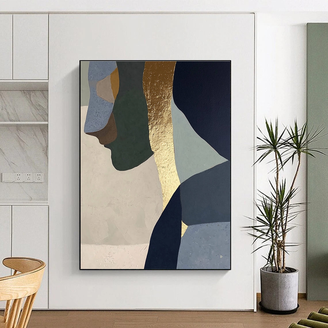 Abstract painting with gold foil depicting a woman in profile, blended neutral tones of sage green, blue, gray, beige, and navy blue.STSC756