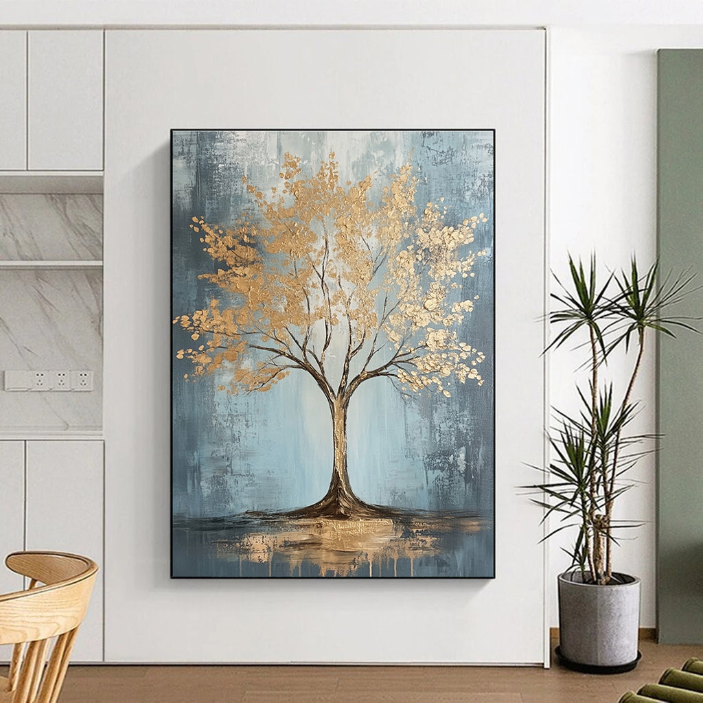 Large abstract painting with gold leaf accents on grey and light blue textured canvas featuring dynamic brush strokes and warm lighting, embodying sophisticated bohemian style.STSC493