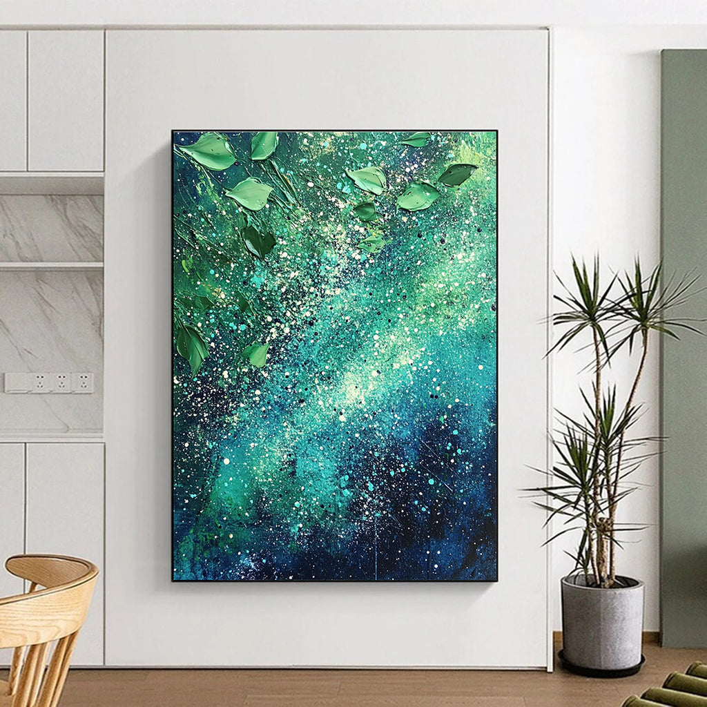 Large abstract painting of the Milky Way featuring vibrant green and blue hues with white speckles and scattered leaves for texture and cosmic beauty.STSC065