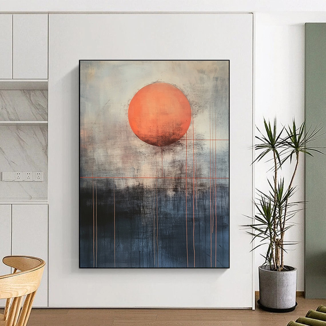 Large abstract painting featuring a mysterious orange sun above dark gray and light blue background with red lines evoking calmness and inner power.STSC1138