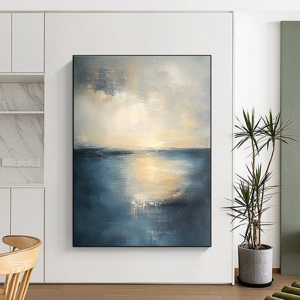 Abstract seascape in muted blue and grey tones with warm yellow sunlight evoking tranquility and reflection on canvas using soft oil paint gradients.STSC461