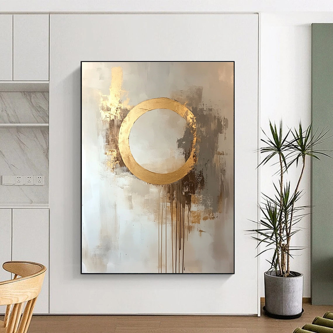 Large abstract oil painting featuring a moon with a golden circle in beige and gold tones with dripping gold leaf on a white background.STSC170