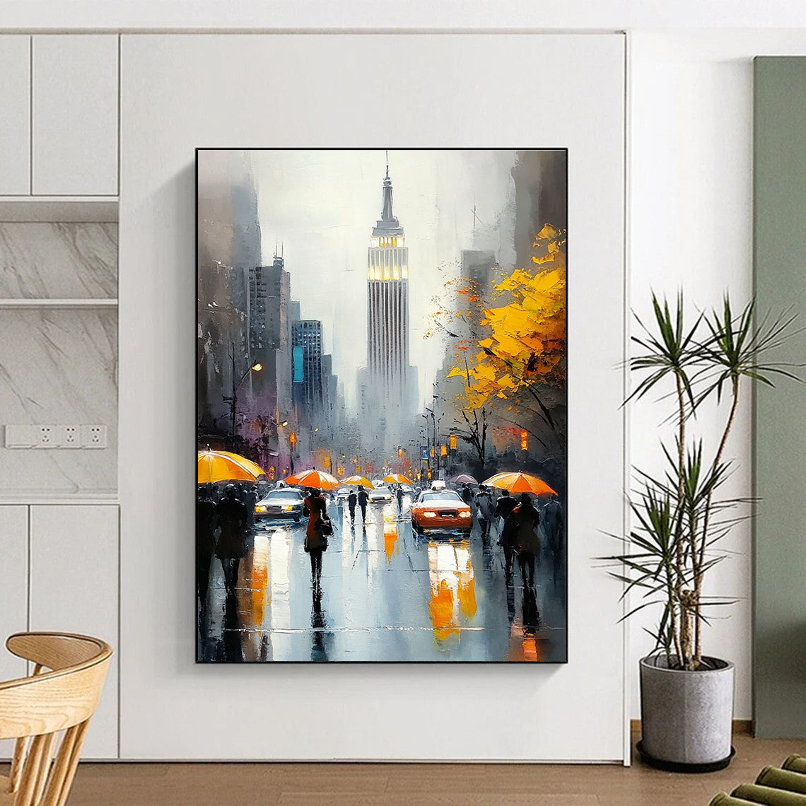 A large abstract painting capturing the Empire State Building with vibrant crowds on a rainy day featuring reflections and warm accents.STSC1137