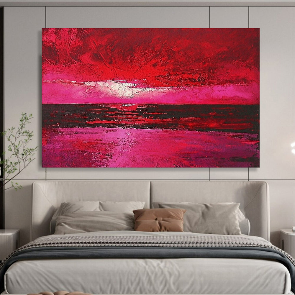 Large abstract painting depicting a red sky over the sea with hues of pink and crimson capturing the beauty of a sunset.SC273