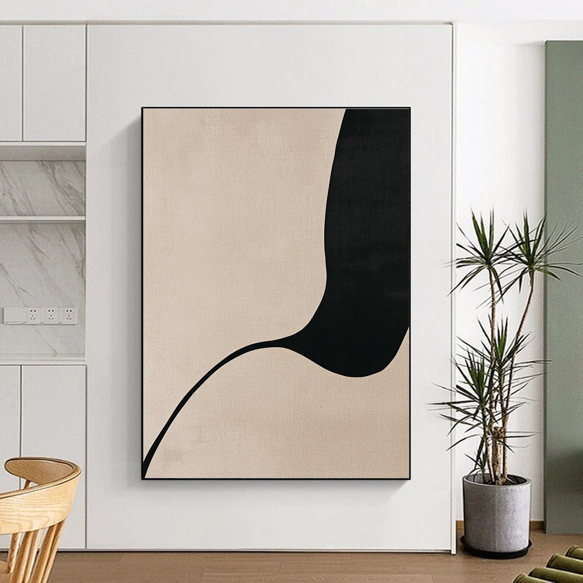 A large abstract painting featuring minimalist Japandi art with body curves in black line drawing on a soothing beige background.STSC1341