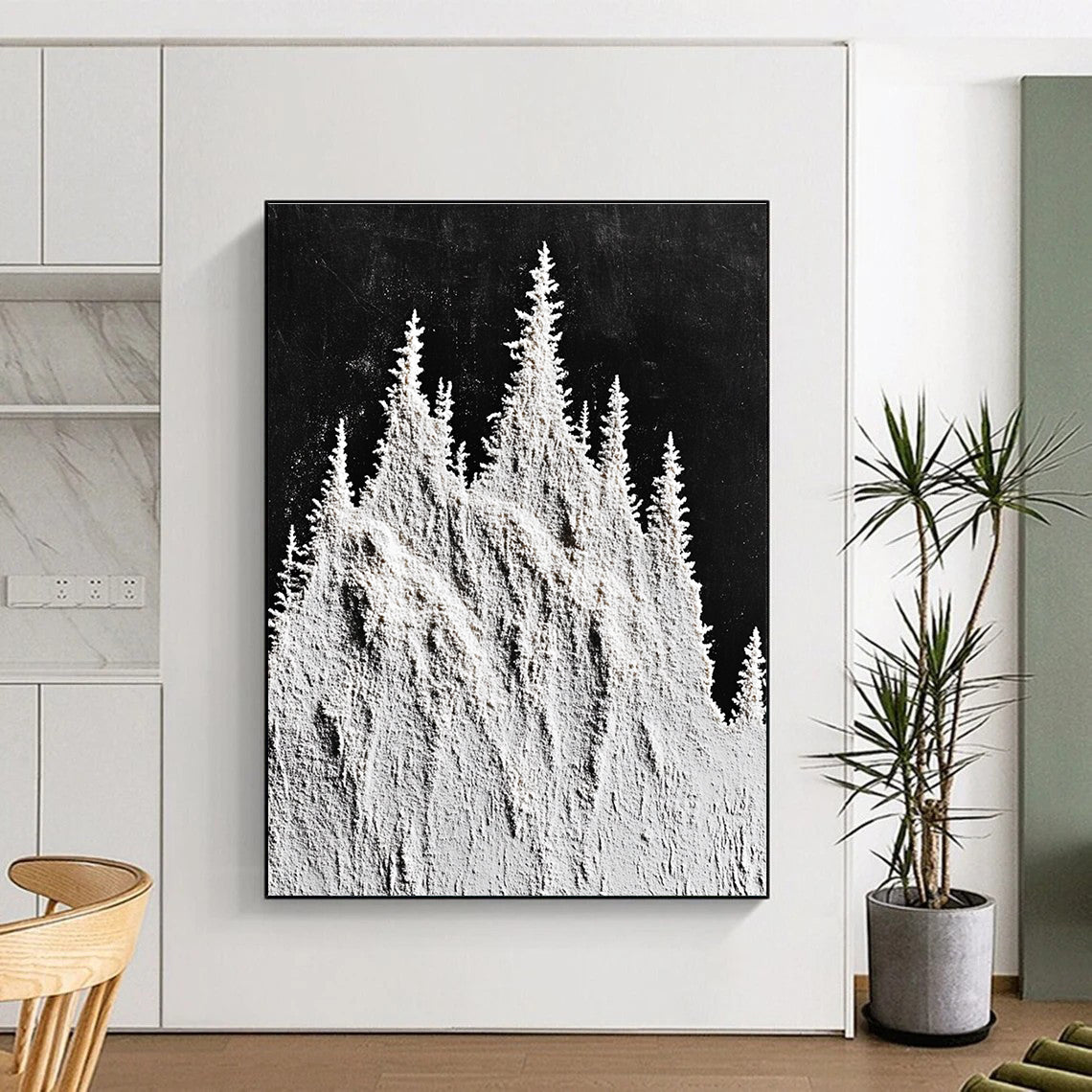Large abstract painting featuring snow-capped mountain peaks and trees in white powder on a textured black background.STSC1488