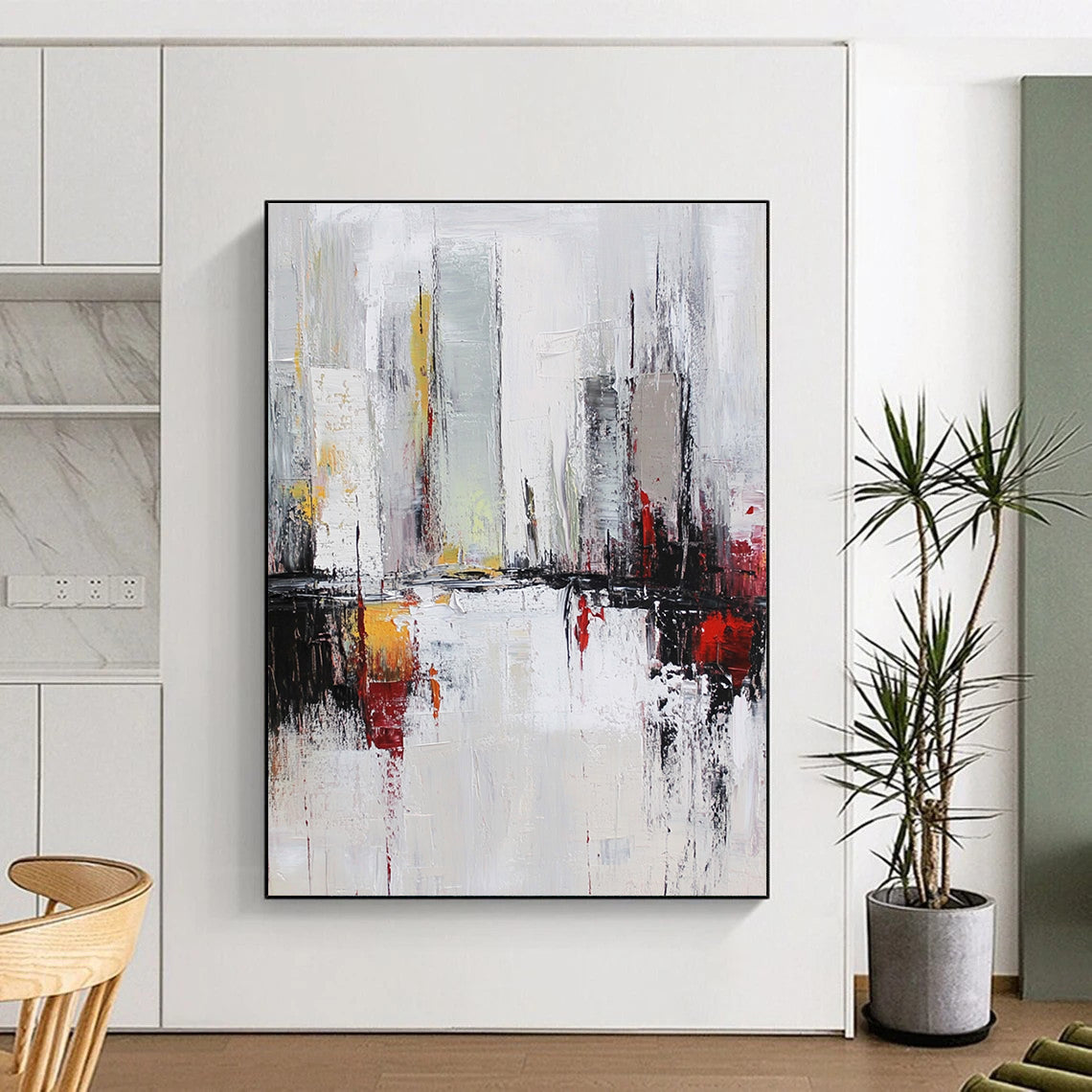Large abstract oil painting of a cityscape in white and grey tones with red accents featuring dynamic loose brush strokes.STSC162
