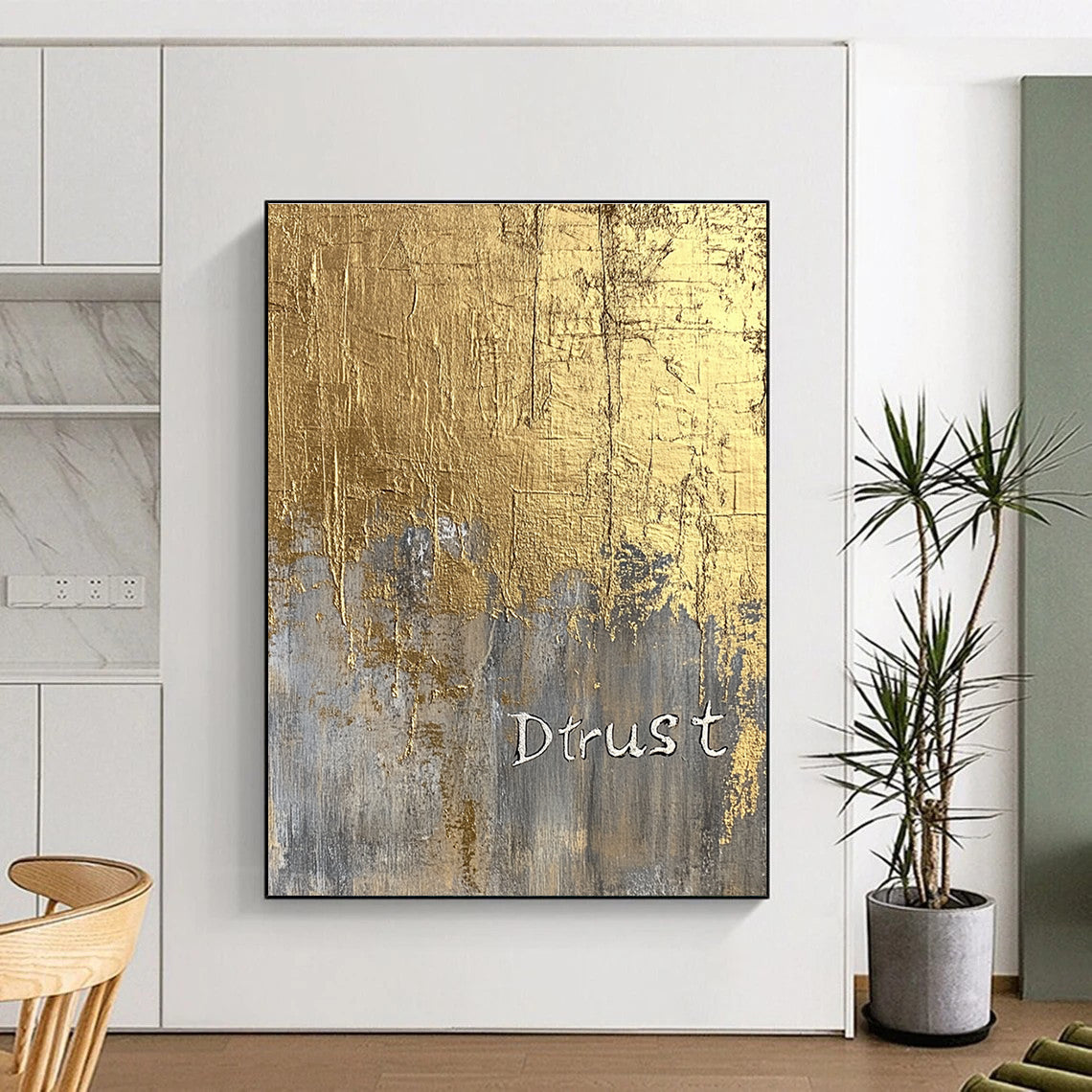 A large abstract painting featuring a gold foil background and textured silver lettering of Dtrust with elegant luxury and depth.STSC1003