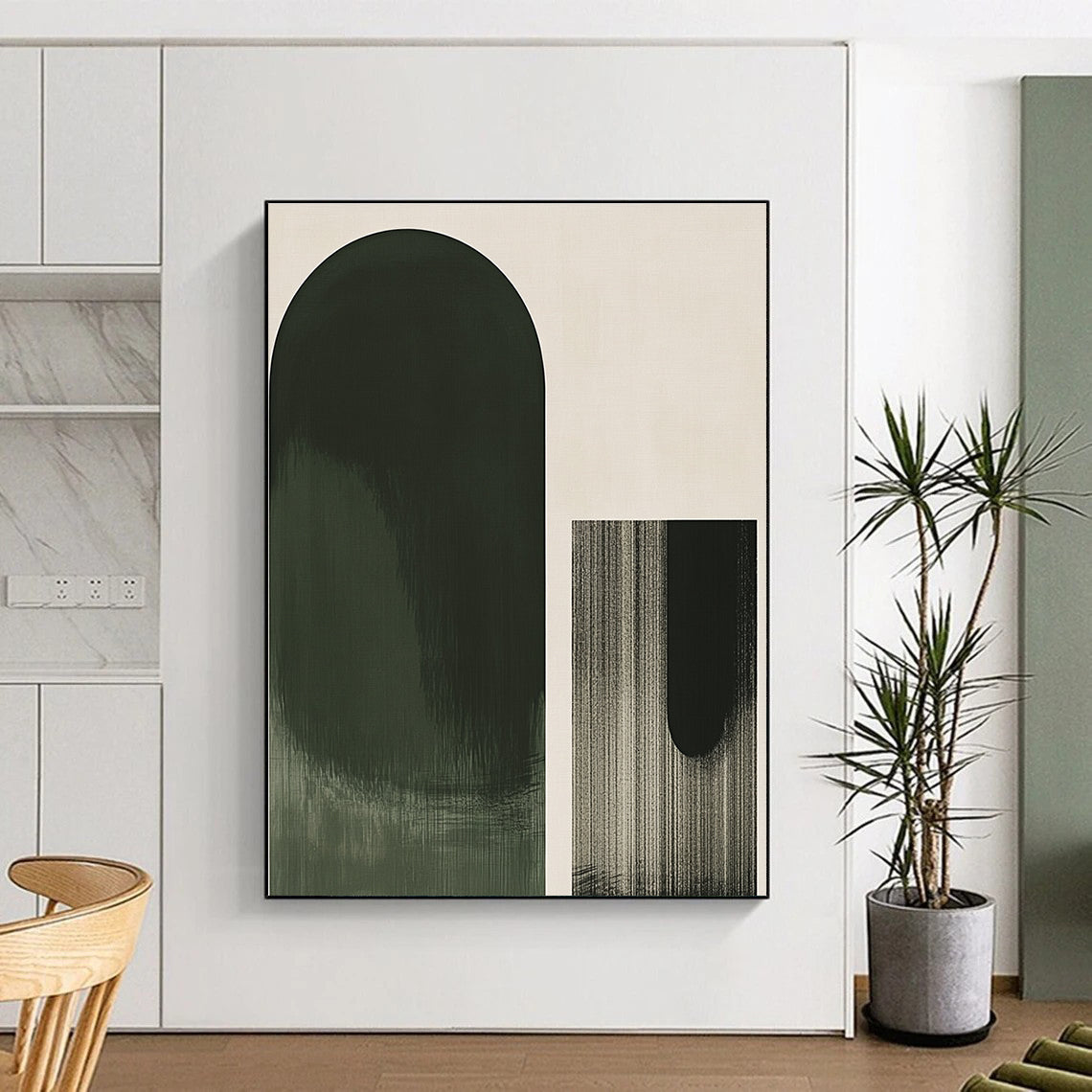 A large abstract green oval contrasts elegantly against a light gray background with a simple black geometric outline in front.STSC1031