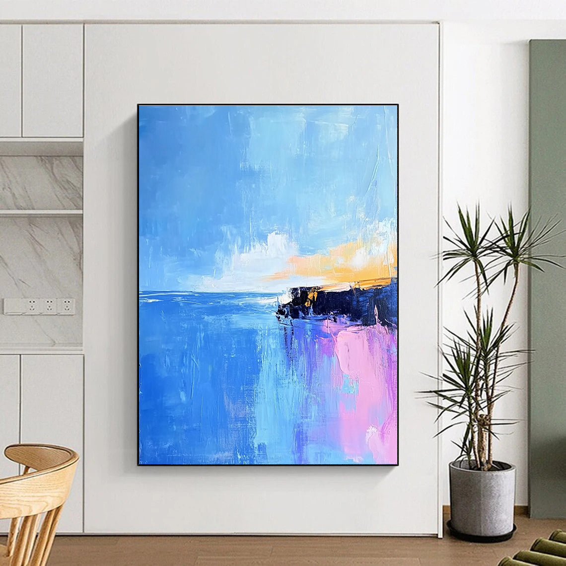 Large abstract painting of Pointe du Hoc's rocky coast in light pink and baby-blue hues with long brush strokes against a vibrant blue sky.STSC598