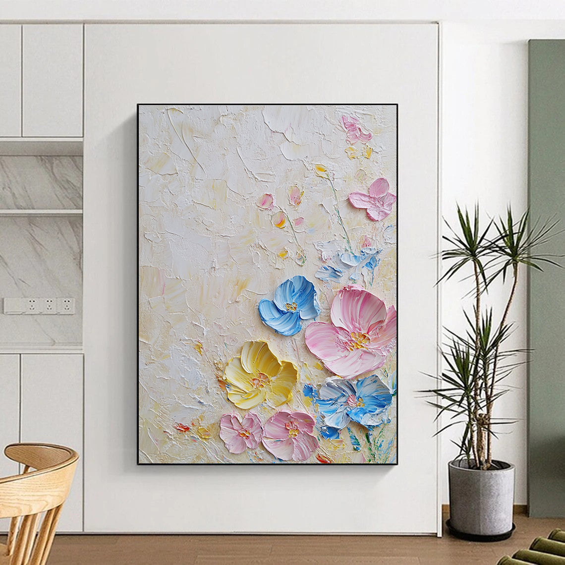 Large abstract painting with textured layers featuring pastel flowers in pink and blue on a white background illuminated by soft lighting.STSC1366