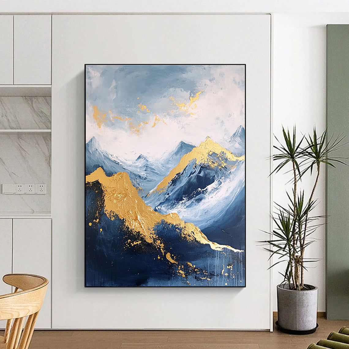 Large abstract painting featuring a golden mountain against a blue sky with white clouds and dark grey stone tones accented with gold.STSC013