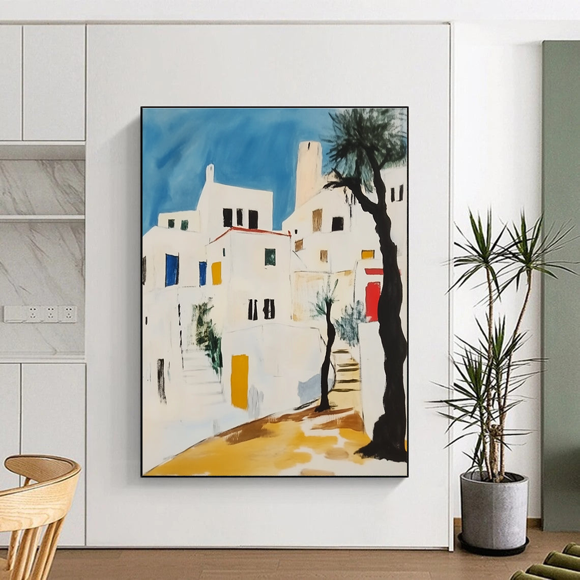 Abstract painting featuring white Greek buildings with black lines yellow accents and red elements against a light blue sky with greenery and a lone tree.STSC1106