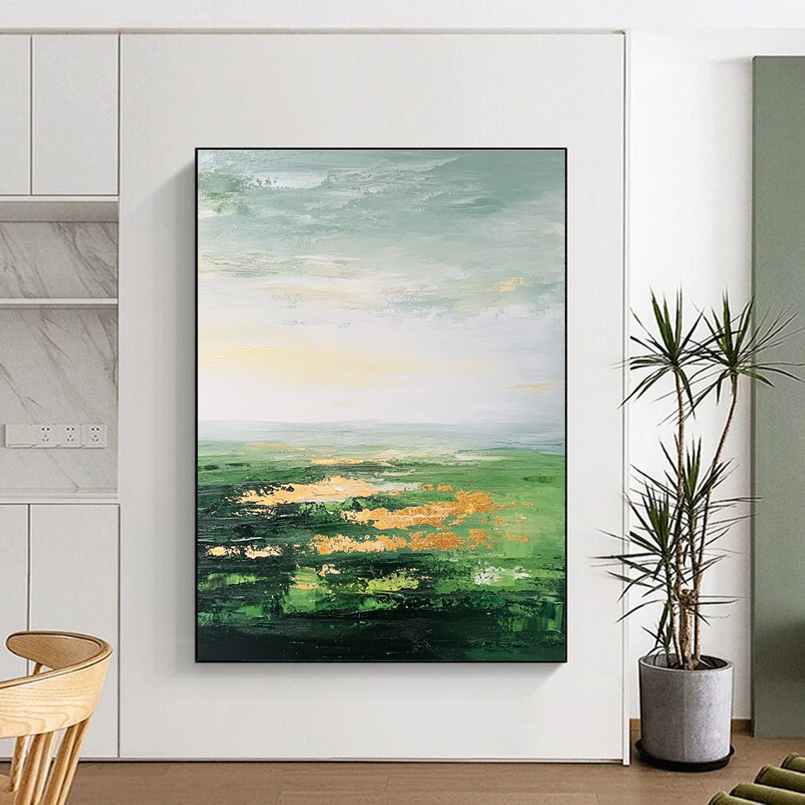 Large abstract painting featuring a vast green landscape soft sky gold accents and thick brush strokes for a dreamy blurry effect.STSC887