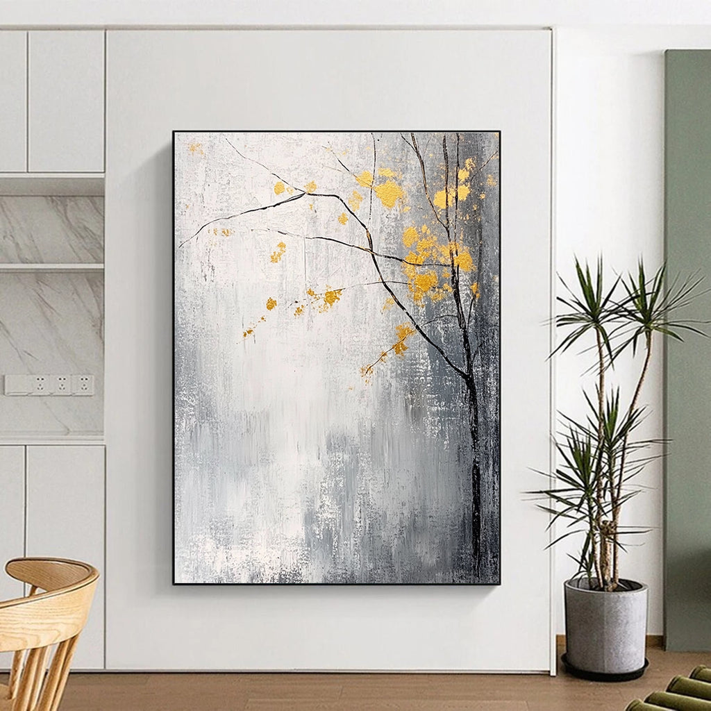 Large abstract painting with gray and white background yellow accents and delicate gold leaves creating a tranquil and mysterious atmosphere.STSC395