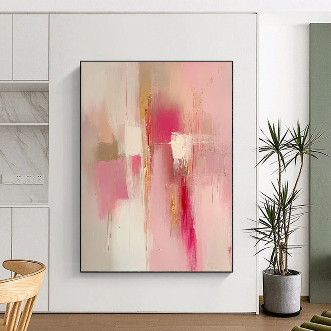 Large abstract painting in pink and gold tones featuring soft edges blurred details and emotional depth creating a serene romantic atmosphere.STSC784