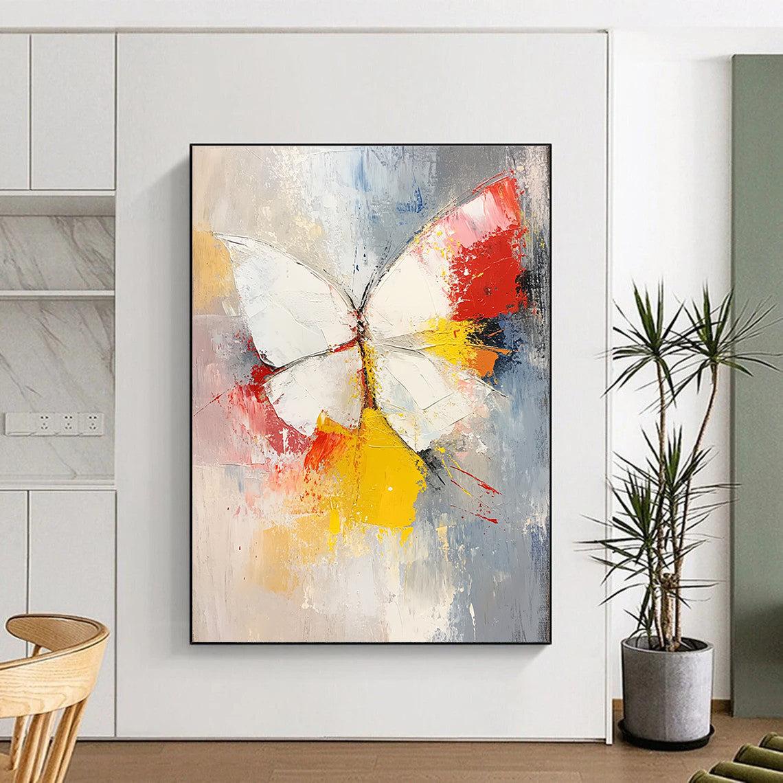 Large abstract painting featuring a white and red butterfly with vibrant yellow feathers set against a soft gray and pink background.STSC552
