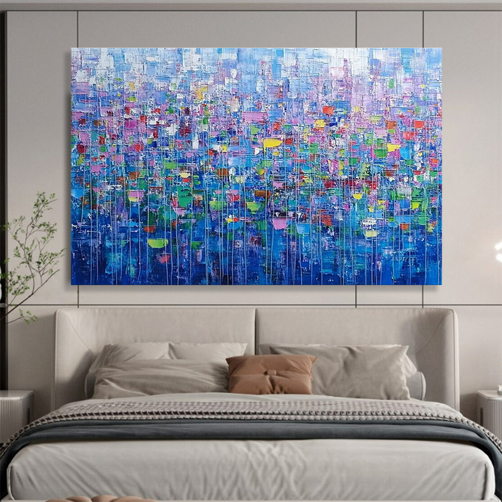 Large abstract painting of an urban landscape created with colorful squares and lines resembling small flowers in vibrant shades.SC474