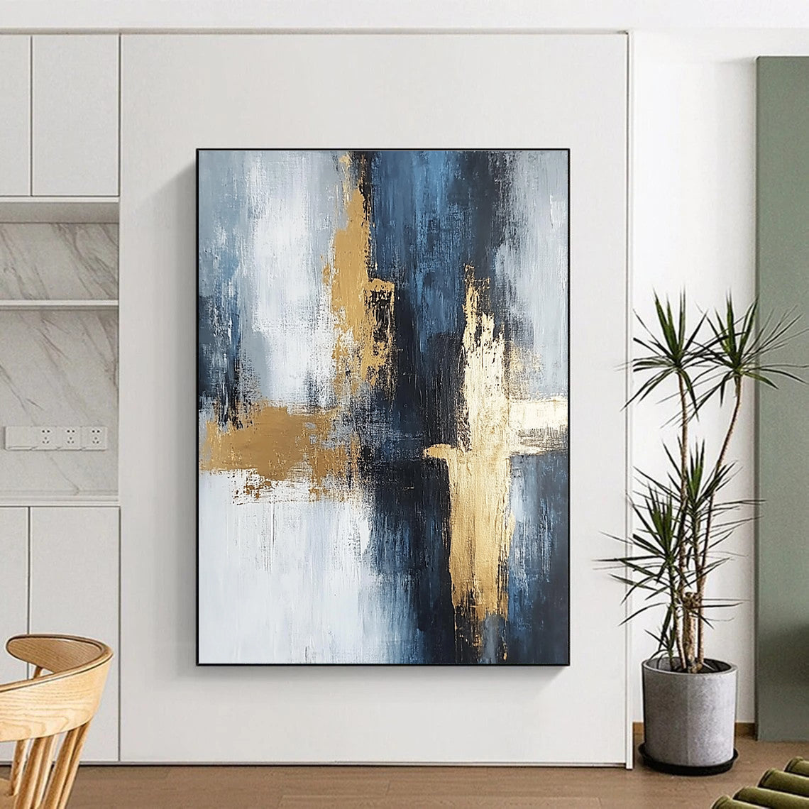 Large abstract painting in light gray and dark blue tones with gold accents featuring strong brushstrokes and delicate textures creating spatial depth.STSC433
