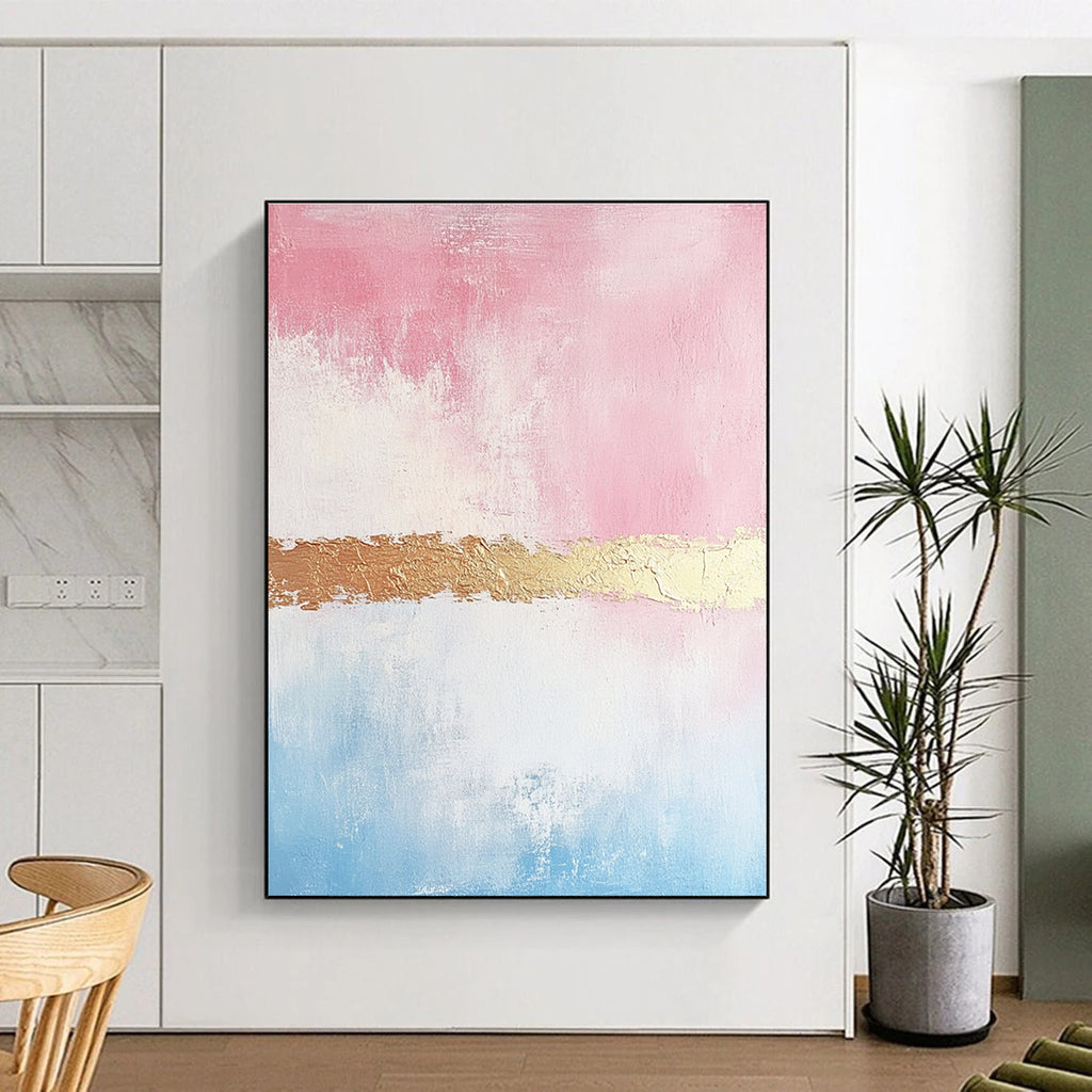 Large abstract painting with soft pink and gold tones textured brushstrokes and a delicate golden line enhancing its minimalist elegance.STSC454
