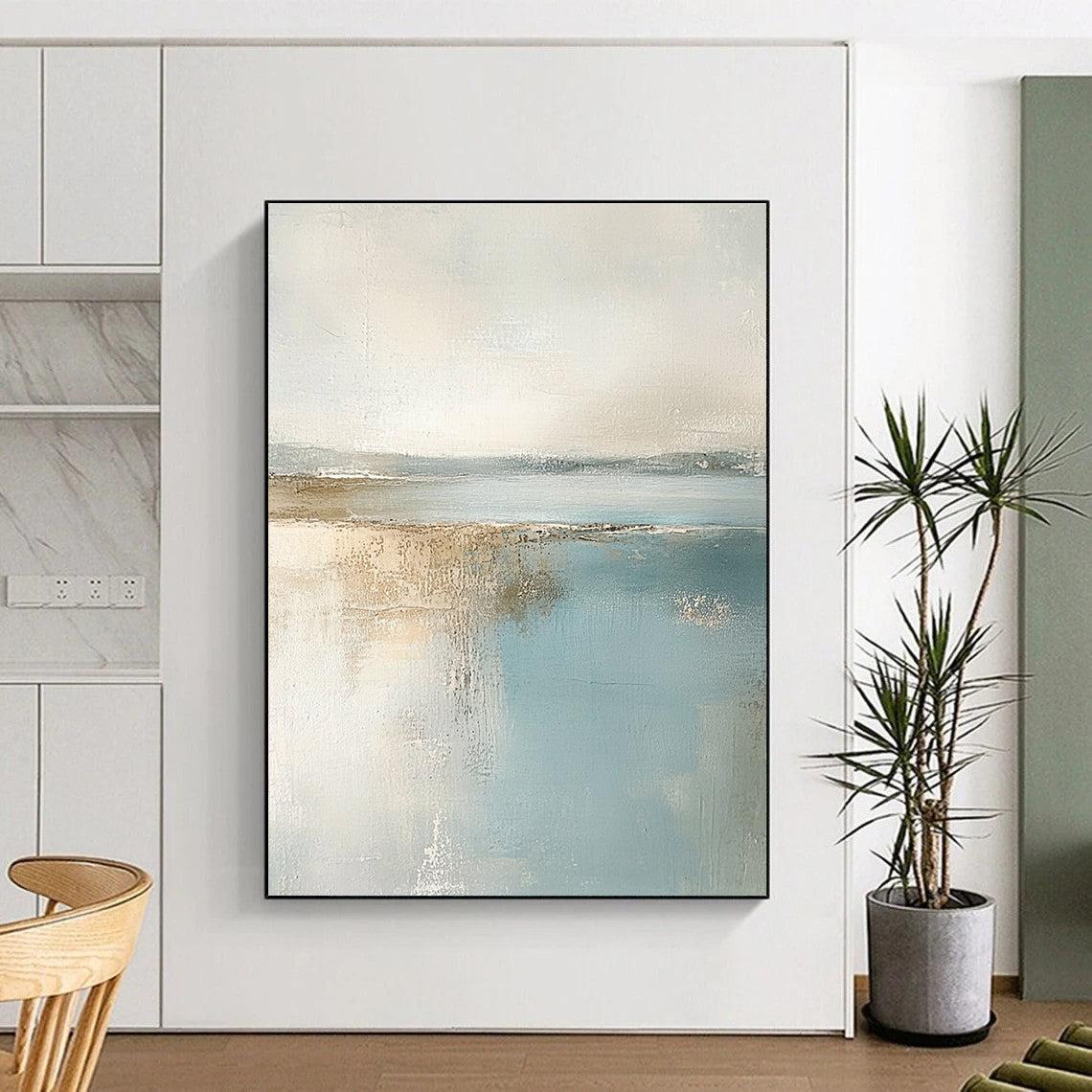 Large abstract painting featuring muted pastel colors of beige and light blue creating a calming beach landscape in neutral tones.STSC017