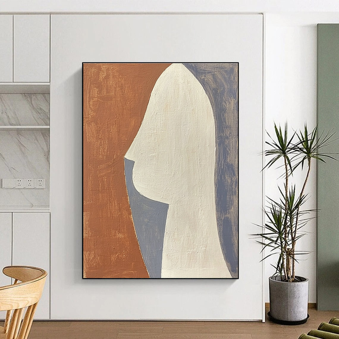 Large abstract painting featuring a profile design in terracotta white and grey composed of simple shapes.STSC1370