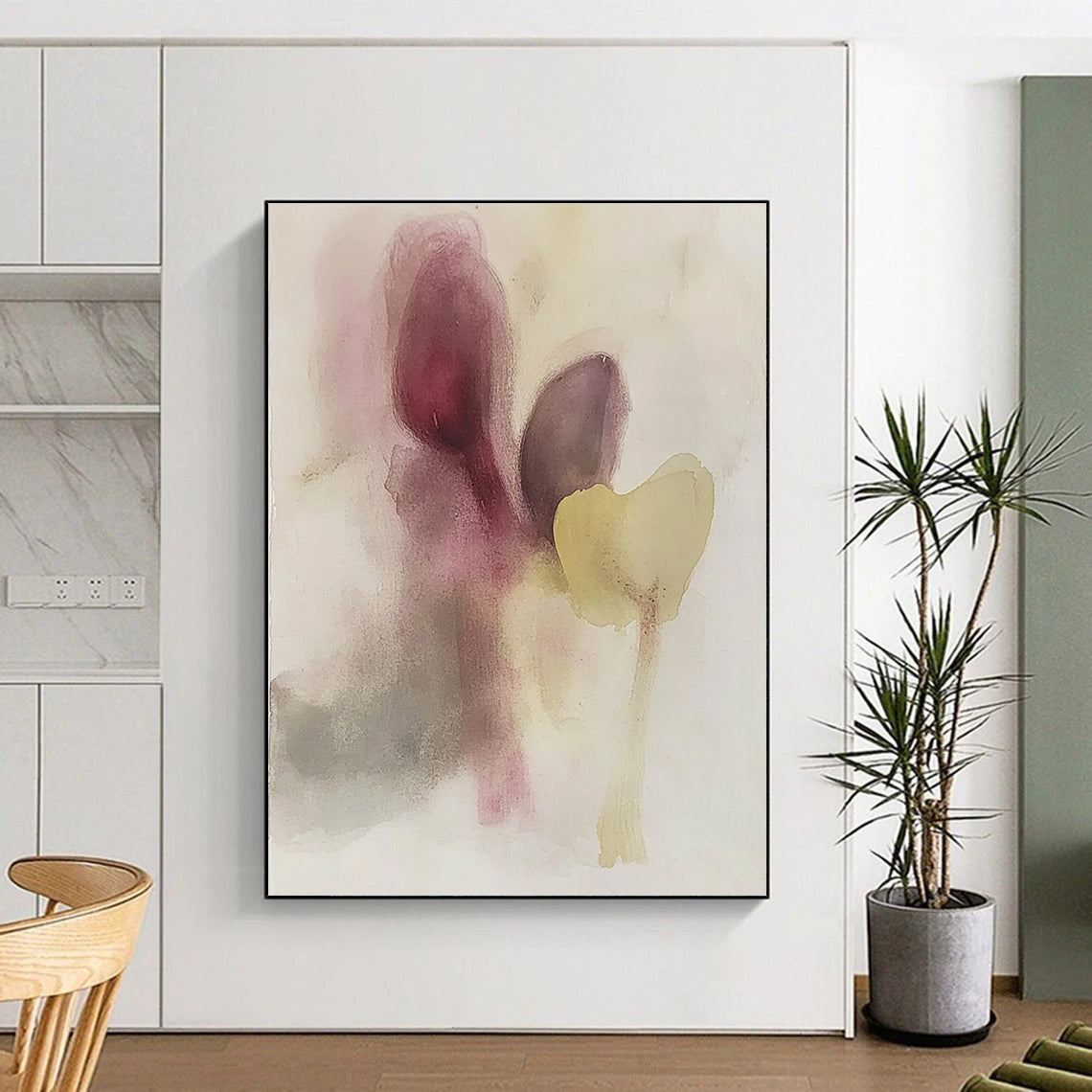 Large abstract painting featuring muted colors soft shapes resembling eggplant and flowers with subtle hints of faces in watercolor.STSC503