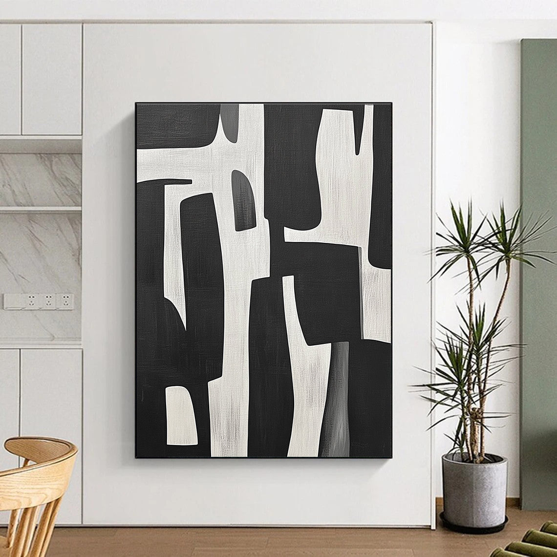 Large abstract painting of black and white shapes inspired by Jean-Paul Gaultier's style showcasing bold contrasts and dynamic forms.STSC328