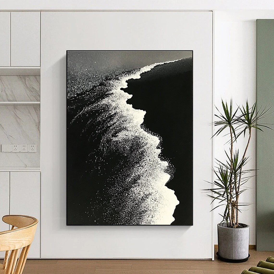 Large abstract painting of ocean waves blending into a white beach with contrasting black sand captured in a dynamic perspective.STSC1430
