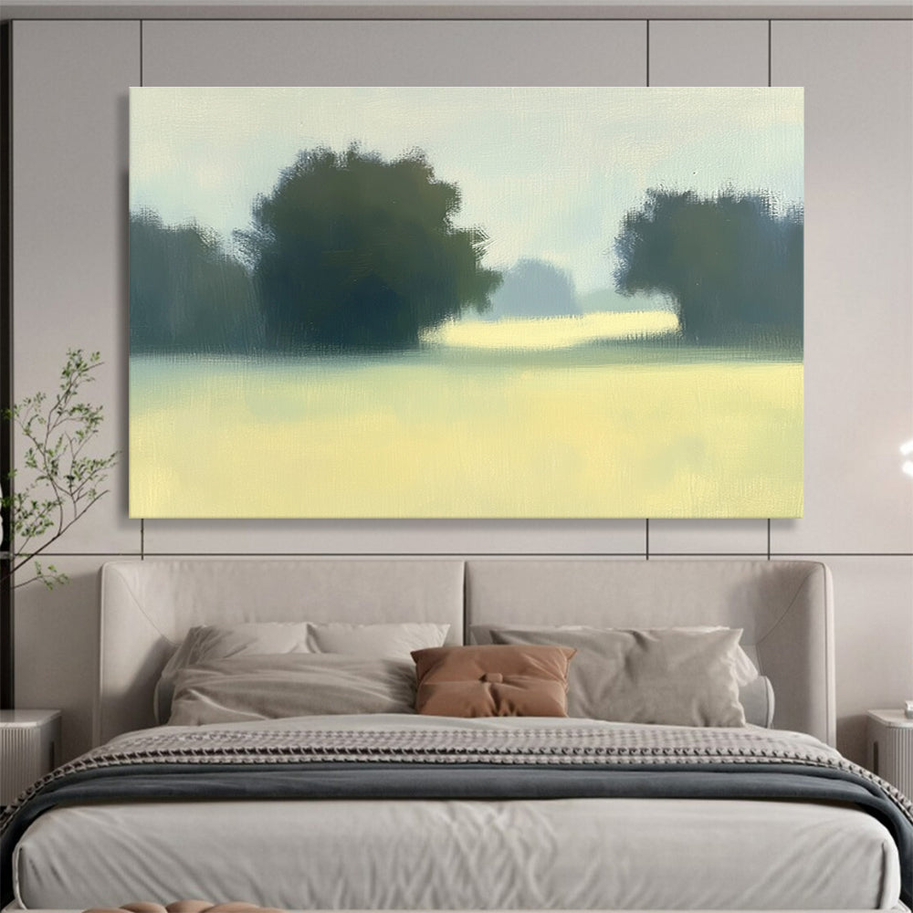 A large abstract painting featuring impasto technique with soft hues of green and yellow depicting a hazy field with distant trees.SC498