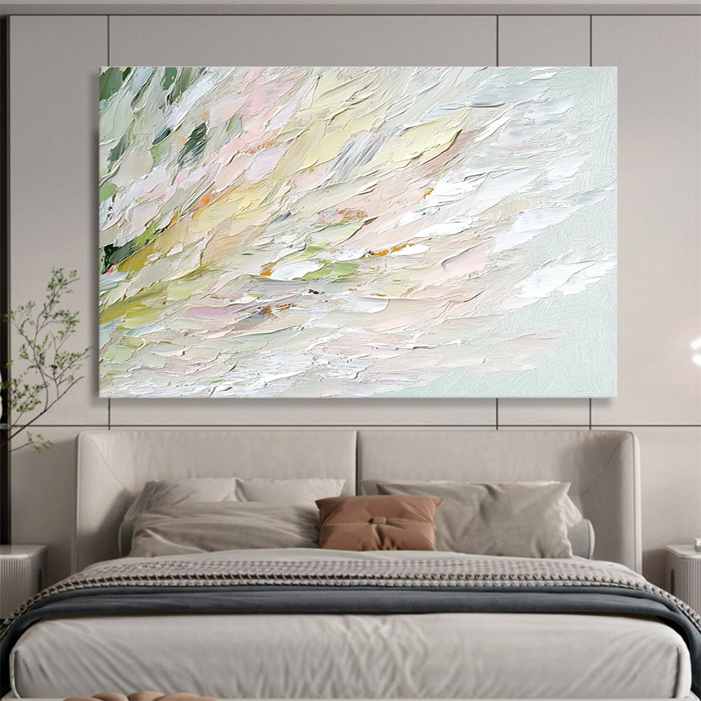 An abstract oil painting features soft swan feathers in whites greens pinks and yellows with a blurred water ripple background enhancing tranquility and elegance.SC450