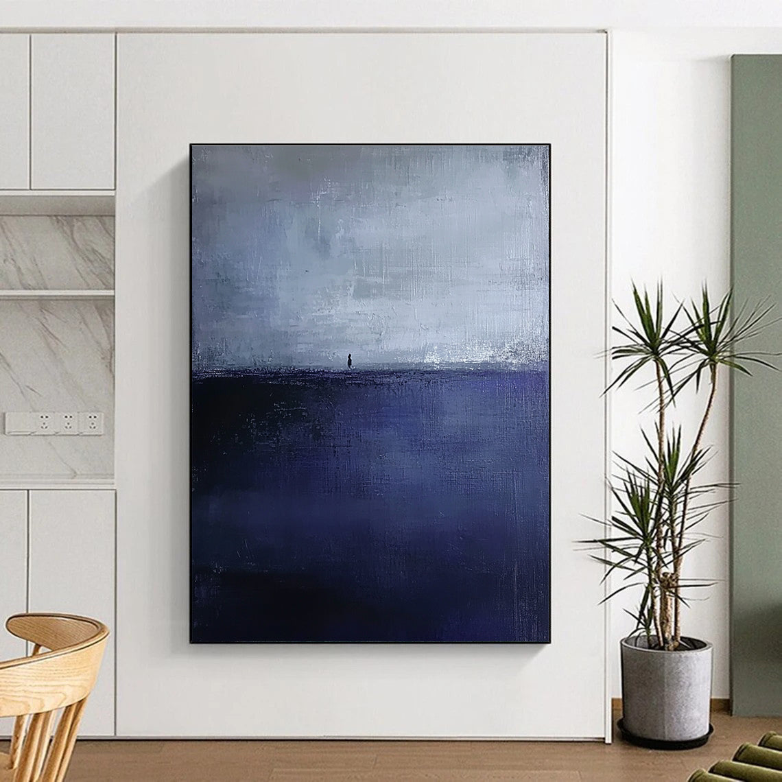Large abstract painting in dark blue and gray depicting an atmospheric seascape with a small silhouette on the distant horizon.STSC1085