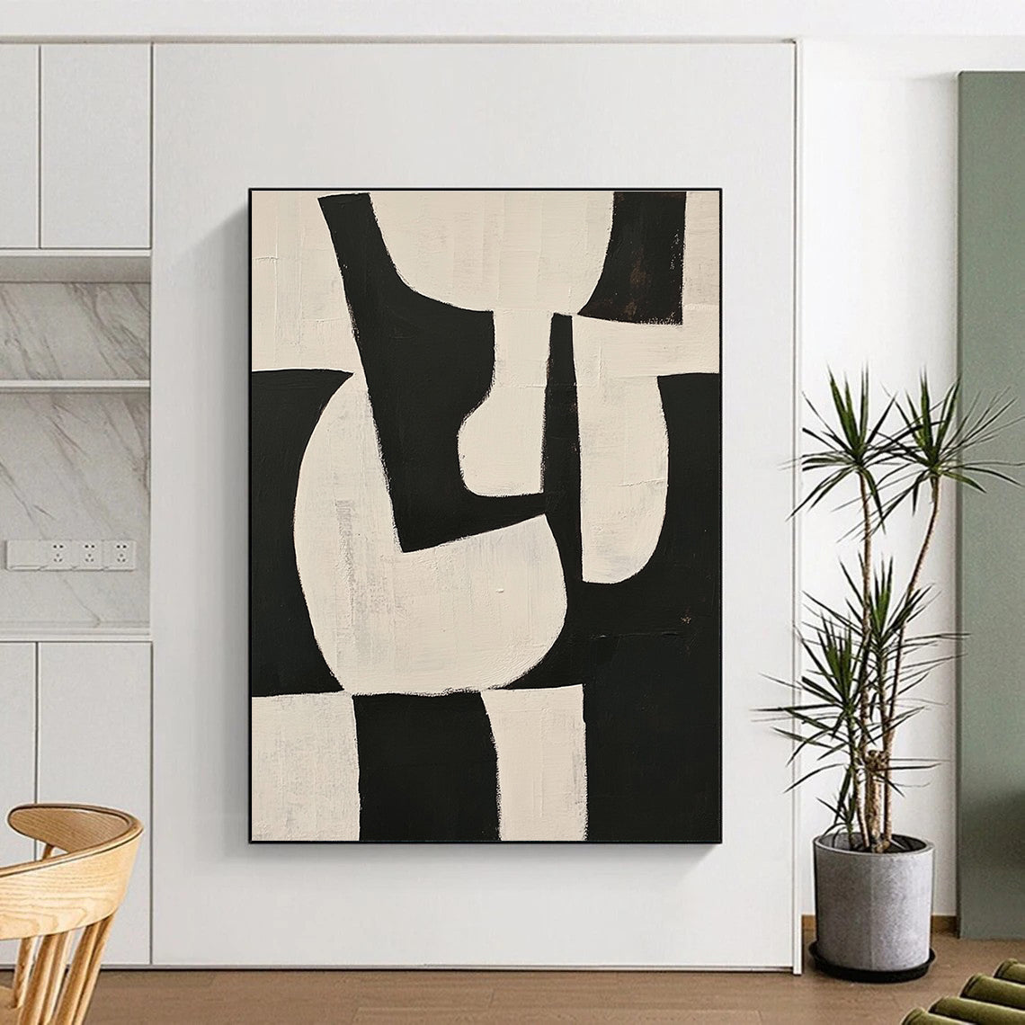 Large abstract painting featuring black and white shapes on a beige background with organic forms and overlapping lines for depth and elegance.STSC329