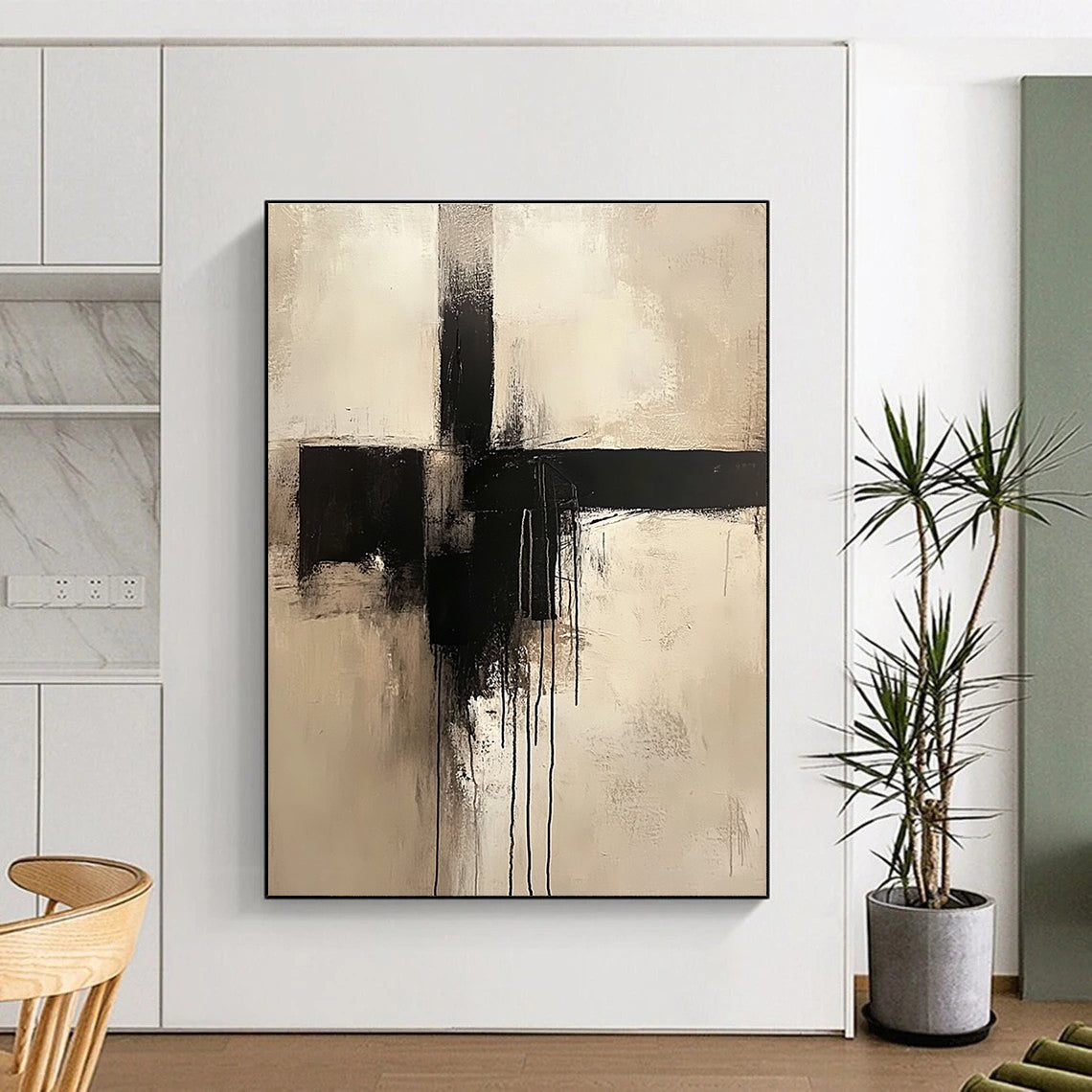 Large abstract painting of a cross in neutral colors featuring a minimalist style and dripping black paint.STSC669