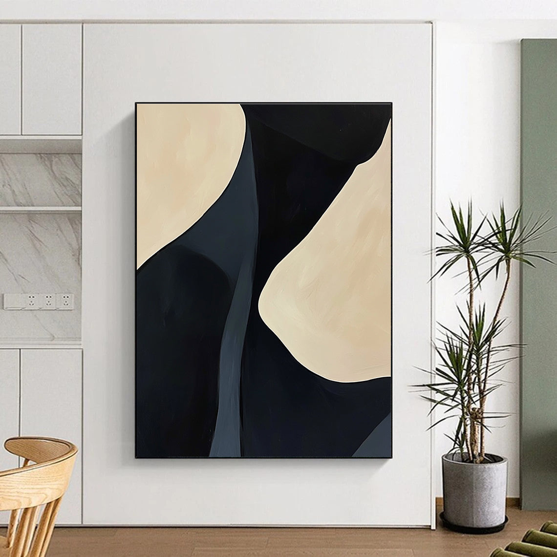 A large abstract painting featuring black and cream feminine curves with organic lines creating a calming effect on a light background.STSC609