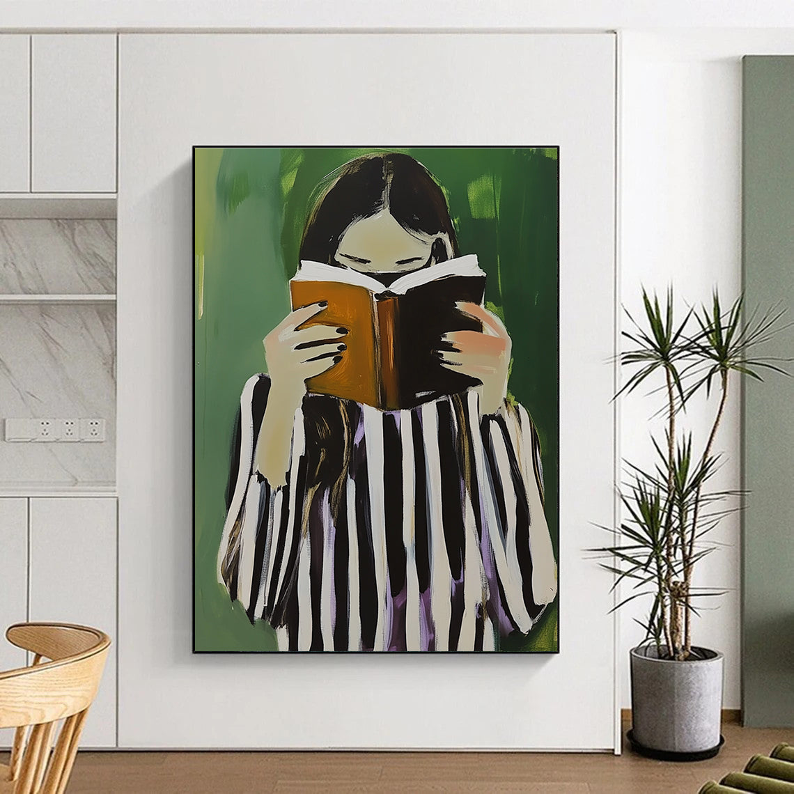 A large abstract painting featuring a woman in black and white stripes holding a book and coffee against a green background.STSC1258