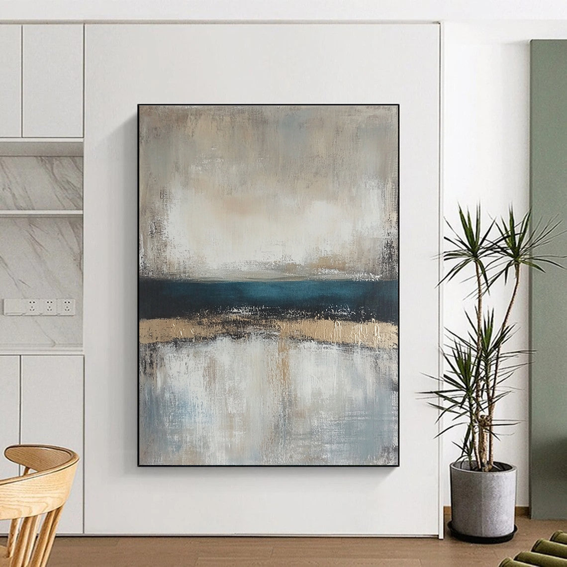 Large abstract painting featuring neutral colors and soft tones of beige gray and blue with a serene horizon line.STSC462