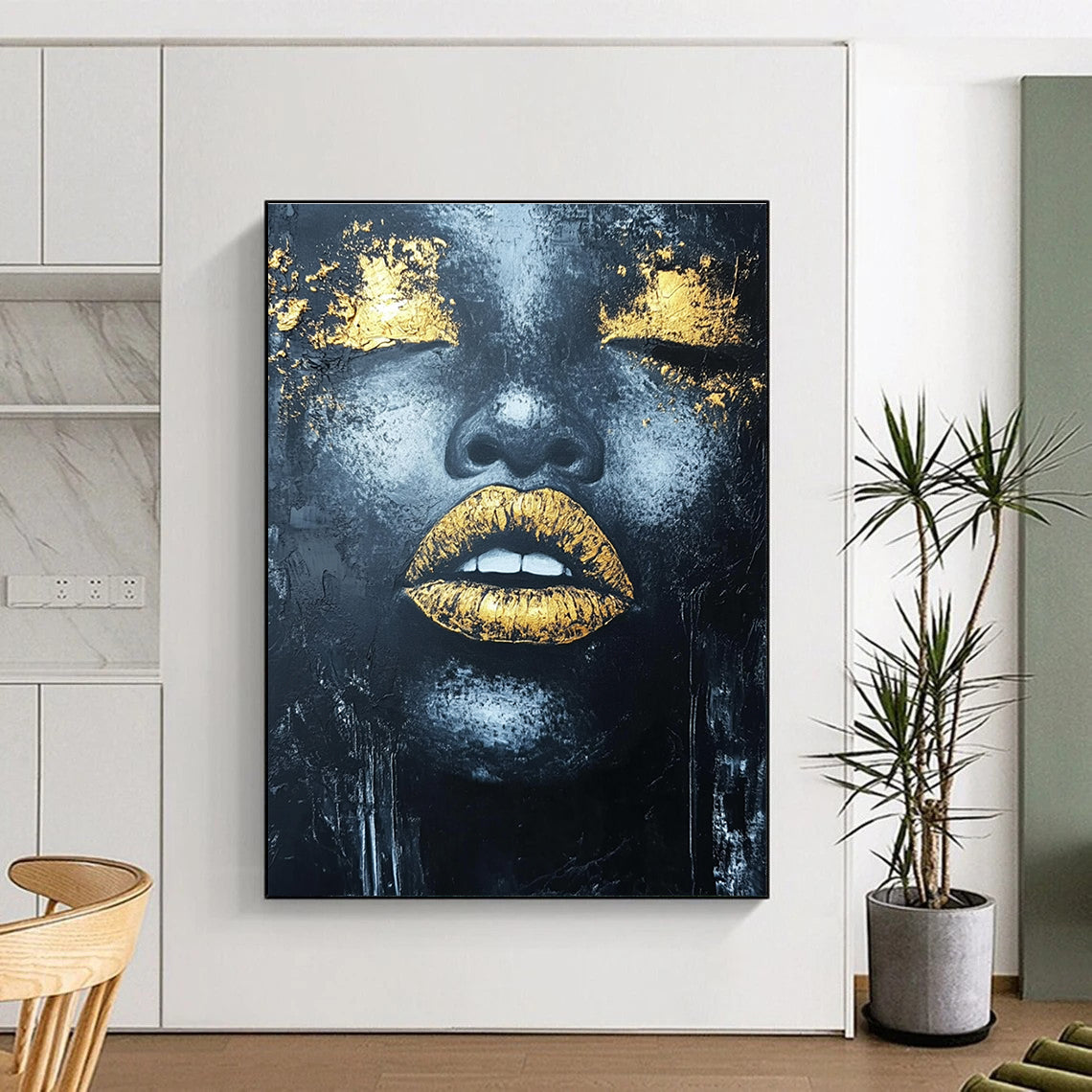 Large abstract acrylic painting of an African woman's lips with gold leaf highlights and textured black background.STSC1276
