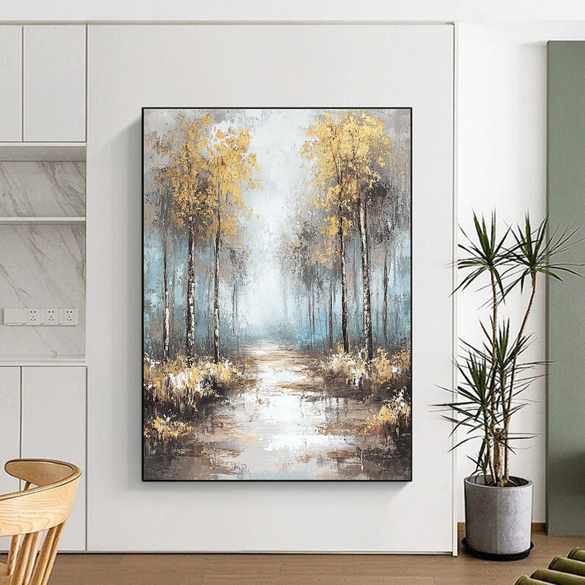 Large abstract painting featuring soft blues and grays with gold leaf accents creating a tranquil misty forest landscape.STSC060