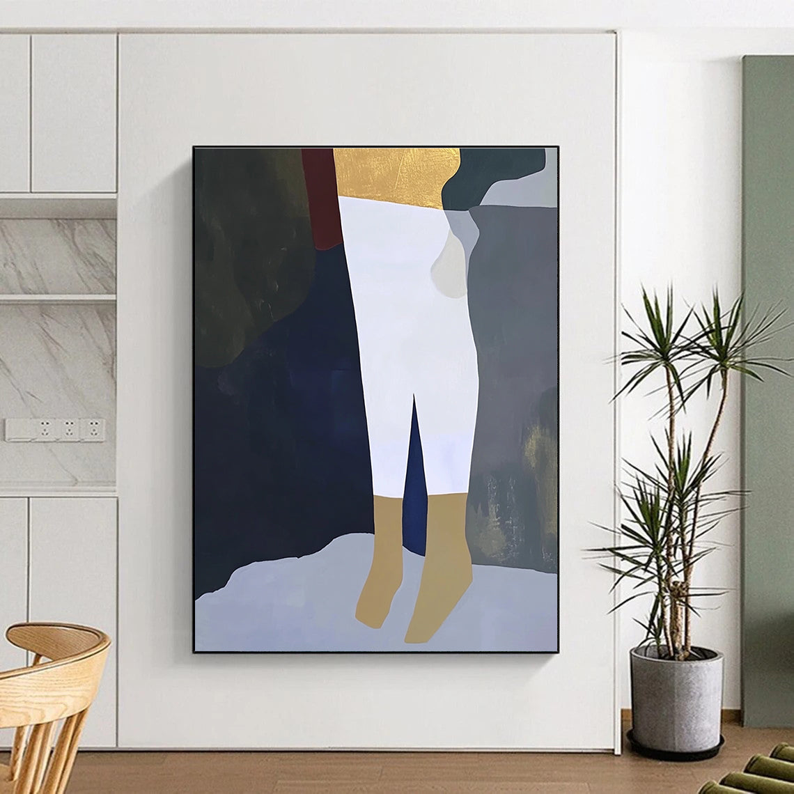 A large abstract painting featuring a close-up of a leg in white trousers and gold socks on a dark grey background in soft colors.STSC960
