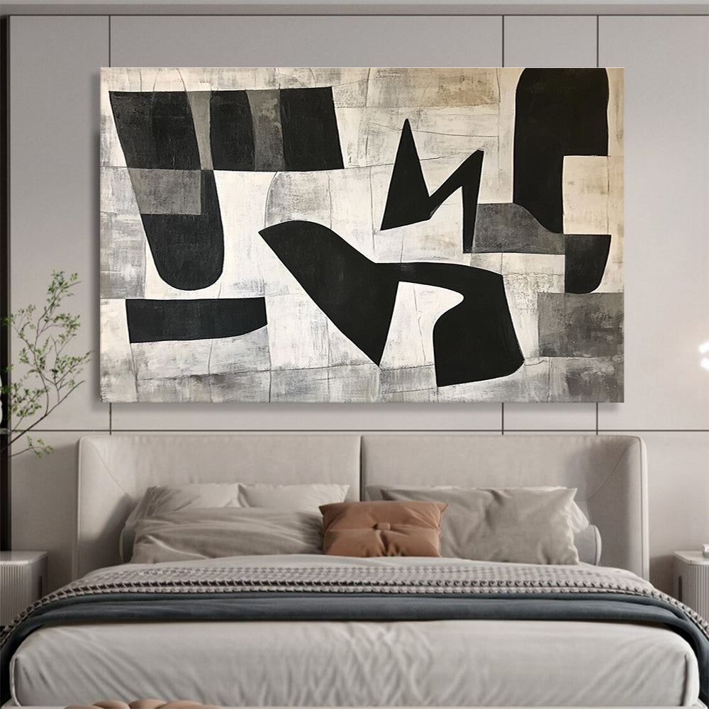 Large abstract painting featuring black and white geometric shapes in the letter K on a textured minimalist background conveying depth and movementSC517