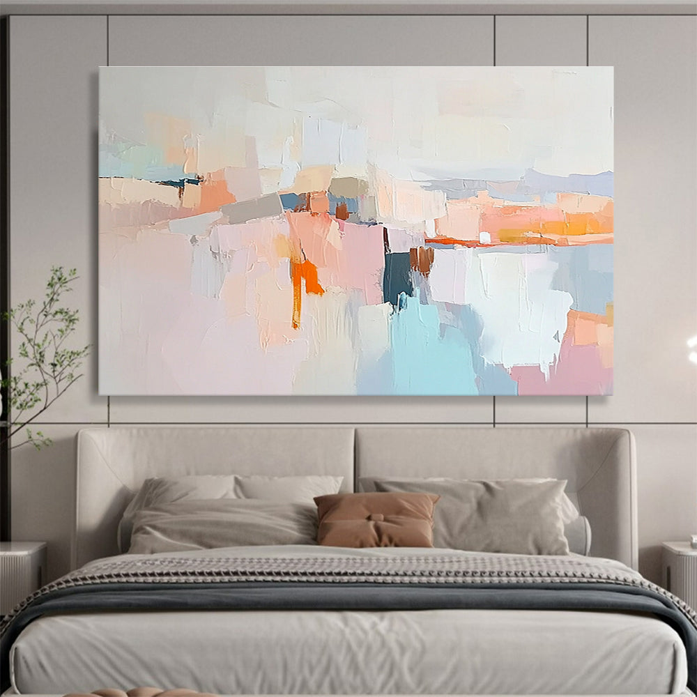 Large abstract painting in soft pastels featuring hills mountains a light grey sky peach-pink clouds and serene water for a calming effect.SC353