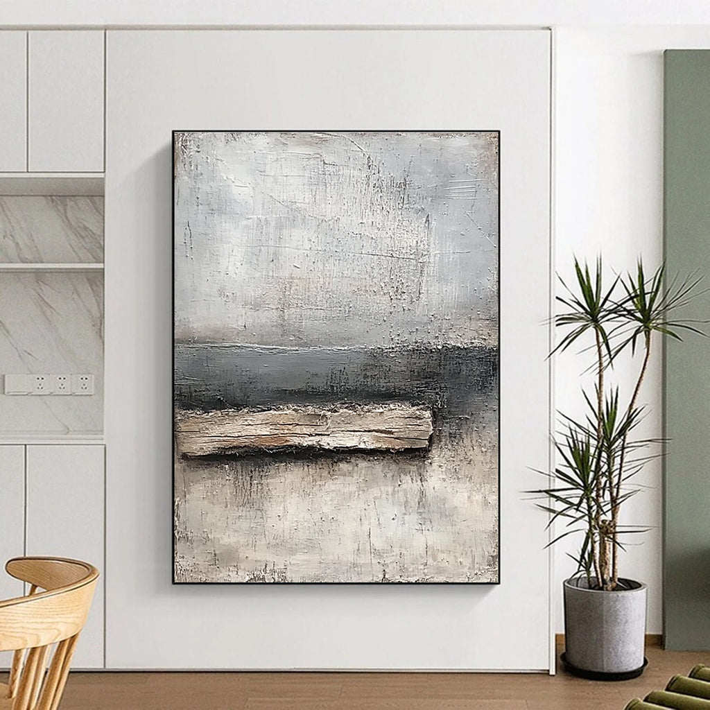 Abstract painting featuring neutral tones of gray and white with textured canvas and thick paint highlighting a small piece of old wood by the water's edge.STSC138